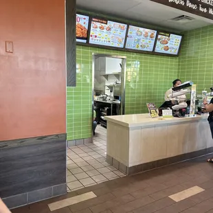 a woman ordering food at a restaurant