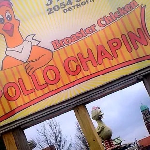 Sign, Big Bird and Most Holy Redeemer Steeple in background.