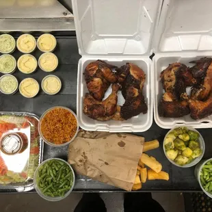 SuperBowl Platter-  2 whole chickens with spanish rice, fried yuca, sauteed green beans, sauteed brussel sprouts, and a house salad.