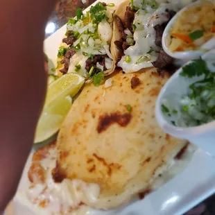 Bean and cheese papusa with carne asada tacos