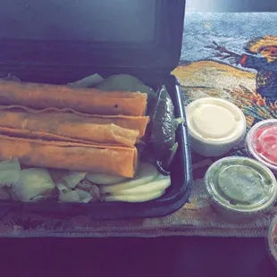 4 flautas, two sides, sour cream, guacamole, onions, red salsa, salad w cucumberss, and one drink for $6.29!