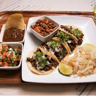 a plate of tacos and chips