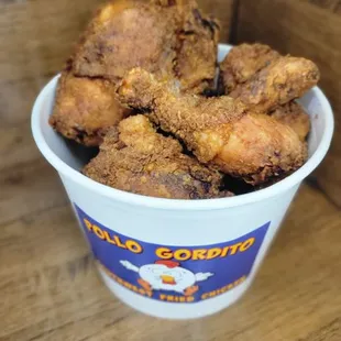 A family bundle that consists of 12 pieces of Broasted chicken three large sides and six cheddar and garlic biscuits!!!