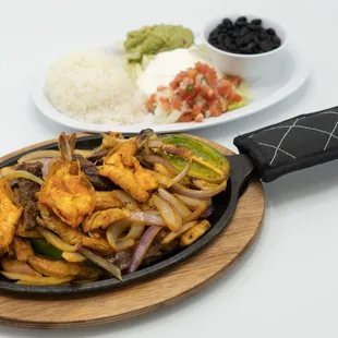 a plate of food and a bowl of rice