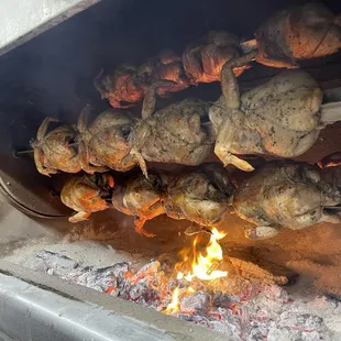 Rotisserie chickens on spikes