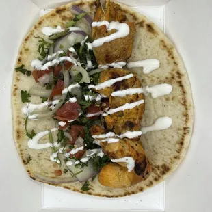 Chicken kabob on pita