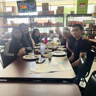 a group of people sitting at a table