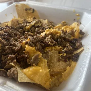 a plate of nachos on a table