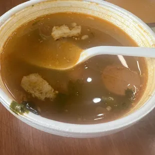 a bowl of soup with a spoon in it