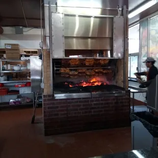 Wood burning rotisserie