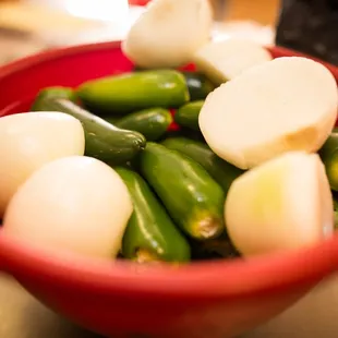 a bowl of pickled peppers
