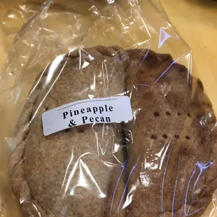 a sandwich wrapped in plastic