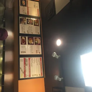 menus on the wall of a restaurant