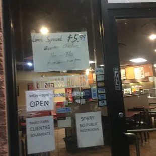 a sign in the window of a restaurant