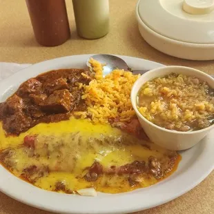Cheese enchiladas with carne guisada rice and beens.
