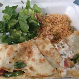 Delicious chicken quesadilla, Spanish rice and decoration salad.