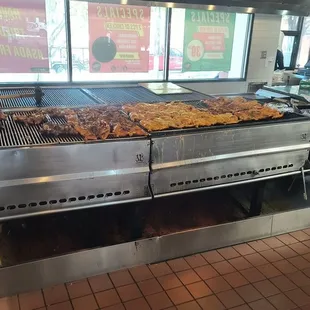 Marinated chicken on the grill.