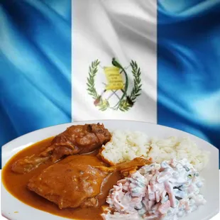 a plate of food with rice and meat