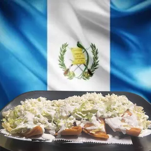 a plate of food with a flag in the background