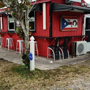 a red building with a flag painted on it