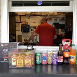 Peeking in thru the window watching them Preparing food