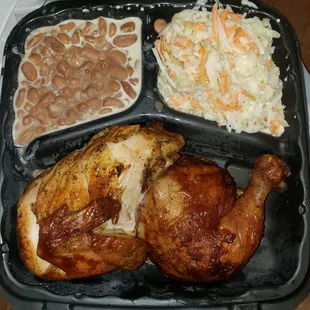 a meal of chicken, beans and coleslaw