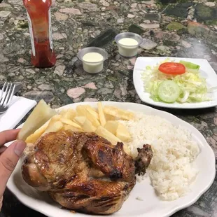1/2 Pollo with yuca, rice and salad. Delicious.