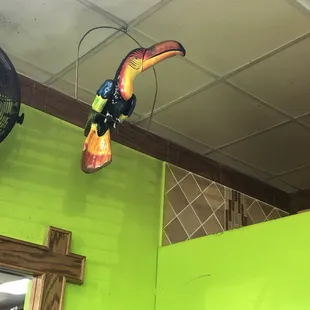 Wooden toucan watching everyone.