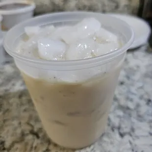 a cup of coffee with ice cubes
