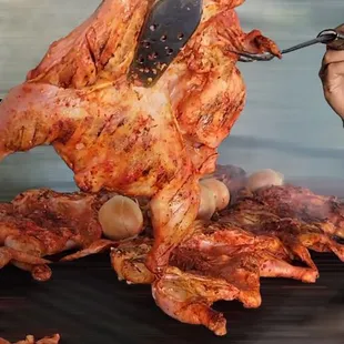 a man cutting a piece of meat