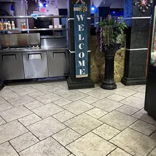 a welcome sign in a restaurant