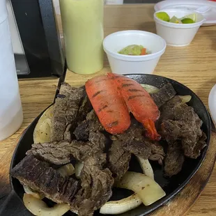 One 1/2 lb. Fajita beef and Sausage Grilled