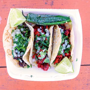 1 Carne Asade Taco and 2 Al Pastor Tacos