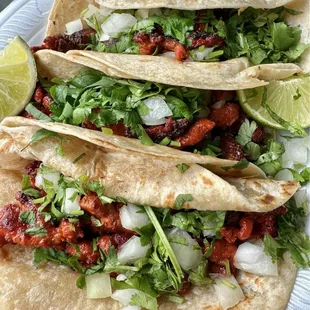Al pastor taco on flour tortilla