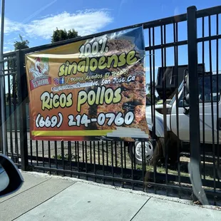a sign on a fence