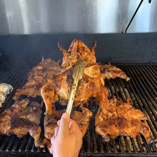 a person cooking on a grill