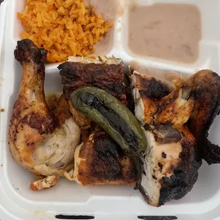 2 pollos y 2 sides sofrie beans and Spanish rice