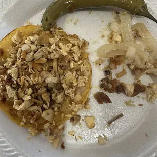 Dry chicken, hard pieces of meat, piece of bone found in taco