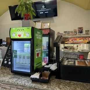 Drink options, utensils; and more drinks in the back!