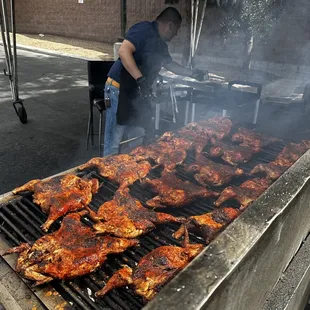 a man cooking on a grill