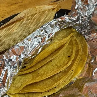 a bunch of bananas wrapped in tin foil