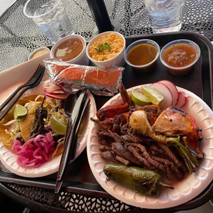 Two carne asada tacos (left) and 1/2 Plato Campechano (right)!