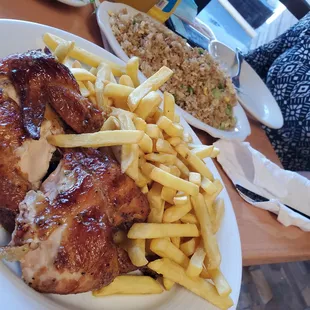 Pollo la brasa (medio pollo) fries and arroz chaufa.