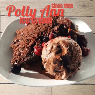 Chocolate Brigadeiro Cake with Brigadeiro Ice Cream topped with juicy berries.