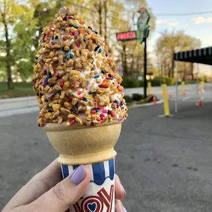 an ice cream cone with sprinkles