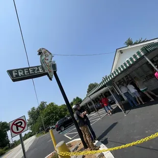 a woman standing in front of a store