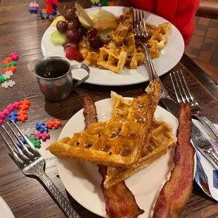 a plate of waffles and bacon