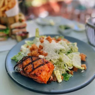 Caesar salad with grilled salmon