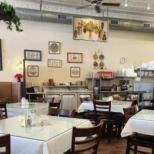 the dining area with tables and chairs