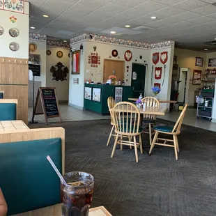 the dining area with tables and chairs